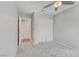 Bedroom with ceiling fan, carpet, and a closet with sliding doors at 7973 Macklin St, Las Vegas, NV 89129