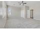 Bedroom featuring neutral carpet and multiple doors and windows at 7973 Macklin St, Las Vegas, NV 89129