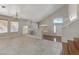 Bonus room with tile flooring, neutral paint, and access to the stairs at 7973 Macklin St, Las Vegas, NV 89129
