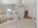 Tile floor bonus room features neutral paint and access to the stairway at 7973 Macklin St, Las Vegas, NV 89129