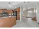 Open kitchen with tile floors and access to the living space at 7973 Macklin St, Las Vegas, NV 89129