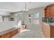 Bright eat-in kitchen features tile floors and a seating area at 7973 Macklin St, Las Vegas, NV 89129
