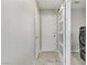 Laundry room with tile floors, standard doors, barn door and front load laundry machines at 7973 Macklin St, Las Vegas, NV 89129