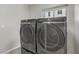 Laundry room with front load washer and dryer at 7973 Macklin St, Las Vegas, NV 89129