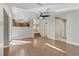 Spacious living room with hardwood floors and view to the kitchen at 7973 Macklin St, Las Vegas, NV 89129