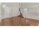 Open living room with hardwood floors and a light, neutral paint at 7973 Macklin St, Las Vegas, NV 89129