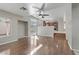 Spacious living room with hardwood floors and views to kitchen and backyard at 7973 Macklin St, Las Vegas, NV 89129