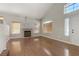Open living room with a fireplace and vaulted ceilings at 7973 Macklin St, Las Vegas, NV 89129