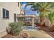 Covered patio overlooks lush backyard with mature landscaping at 7973 Macklin St, Las Vegas, NV 89129