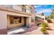 Charming backyard featuring rock landscaping, mature plants and a covered patio at 8216 Chimney Bluffs St, North Las Vegas, NV 89085
