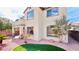 Exterior view of a two-story home, highlighting the yard with attractive rock landscaping at 8216 Chimney Bluffs St, North Las Vegas, NV 89085