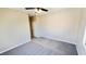 Bedroom featuring neutral paint, carpet and ceiling fan with closet and good natural light at 8216 Chimney Bluffs St, North Las Vegas, NV 89085