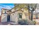 Beautiful stucco home featuring desert landscaping and a decorative wrought iron gate at 8216 Chimney Bluffs St, North Las Vegas, NV 89085