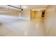 Clean two-car garage featuring neutral paint, epoxy floors, and ample space at 8216 Chimney Bluffs St, North Las Vegas, NV 89085