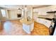 Open kitchen with white cabinets, granite countertops, stainless appliances, and a large island at 8216 Chimney Bluffs St, North Las Vegas, NV 89085
