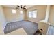 Inviting living room featuring plush carpeting, abundant natural light, and ceiling fan for comfort at 8216 Chimney Bluffs St, North Las Vegas, NV 89085