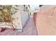 Side yard with rock landscaping providing simple, low-maintenance appeal at 8216 Chimney Bluffs St, North Las Vegas, NV 89085