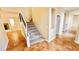 Carpeted staircase with a white handrail and black iron balusters at 8216 Chimney Bluffs St, North Las Vegas, NV 89085