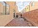 Private backyard featuring a brick privacy fence, paver patio, with bbq grill and outdoor furniture at 9748 Villa Lorena Ave, Las Vegas, NV 89147