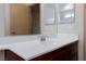 Bathroom vanity with double mirrors, solid surface countertop, and new faucet at 9748 Villa Lorena Ave, Las Vegas, NV 89147