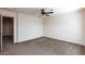 Spacious bedroom featuring a ceiling fan, carpeted floor, and neutral walls at 9748 Villa Lorena Ave, Las Vegas, NV 89147