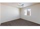 Bedroom with plush carpeting, ceiling fan, and a window for natural light at 9748 Villa Lorena Ave, Las Vegas, NV 89147
