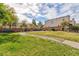 Lush green common area with a sidewalk and benches for residents at 9748 Villa Lorena Ave, Las Vegas, NV 89147