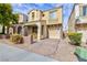 Two story home with stucco and stone exterior, desert landscaping, and an attached one car garage at 9748 Villa Lorena Ave, Las Vegas, NV 89147