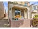 Inviting front porch, stucco exterior, desert landscaping, and an attached one car garage at 9748 Villa Lorena Ave, Las Vegas, NV 89147