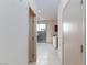 Hallway features tile flooring leading to sliding glass doors with outdoor bbq and breakfast bar at 9748 Villa Lorena Ave, Las Vegas, NV 89147