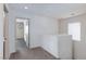 Neutral hallway featuring carpeted floors and bright white walls at 9748 Villa Lorena Ave, Las Vegas, NV 89147