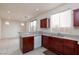 Modern kitchen with dark cabinets, stainless steel appliances, and an open layout at 9748 Villa Lorena Ave, Las Vegas, NV 89147