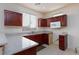 Well-lit kitchen featuring dark cabinetry, modern appliances, and a large window at 9748 Villa Lorena Ave, Las Vegas, NV 89147