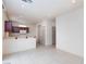 Open kitchen area with a breakfast bar, tile flooring, and modern appliances at 9748 Villa Lorena Ave, Las Vegas, NV 89147
