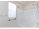 Shower and bathtub combination with sleek fixtures and tiled surround at 9748 Villa Lorena Ave, Las Vegas, NV 89147