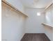 Spacious walk-in closet with shelving and carpeted floor at 9748 Villa Lorena Ave, Las Vegas, NV 89147
