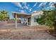 A serene backyard with a covered patio, offering a private space for relaxation and outdoor activities at , Las Vegas, NV 89106