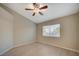 The room includes hardwood floors, a ceiling fan, and a window with blinds, creating a bright and inviting space at , Las Vegas, NV 89106
