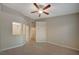 Hardwood floors, a ceiling fan, and an opening leading to a bathroom create a comfortable and connected living space at , Las Vegas, NV 89106