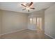 This bedroom offers hardwood floors, a ceiling fan, and an opening into an en suite bathroom for added convenience at , Las Vegas, NV 89106