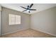 Bedroom with fan, window with blinds, and neutral color palette at , Las Vegas, NV 89106