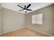 Bedroom featuring ceiling fan and a large window with blinds at , Las Vegas, NV 89106