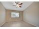 The cozy bedroom boasts hardwood floors, a ceiling fan, and a window with blinds, offering a comfortable living space at , Las Vegas, NV 89106