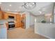 Open concept kitchen featuring stainless steel appliances, wood cabinets and breakfast bar area at , Las Vegas, NV 89106