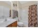 Bright bathroom with a tub/shower combo and stylish fixtures at 10001 Blairwood Ct, Las Vegas, NV 89178