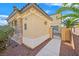 View of the side yard showcasing the gate and stone exterior accents at 10001 Blairwood Ct, Las Vegas, NV 89178