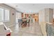 Open-concept living room connected to the kitchen, featuring a dining table and ample seating at 10001 Blairwood Ct, Las Vegas, NV 89178