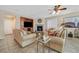 Inviting living room with a fireplace, entertainment center, and tile flooring at 10001 Blairwood Ct, Las Vegas, NV 89178