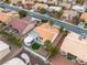 This landscape highlights the manicured lawn and desert scape, plus the architecture of the house at 10329 Bent Brook Pl, Las Vegas, NV 89134