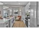 Modern kitchen featuring a large island with seating, stainless steel appliances at 10329 Bent Brook Pl, Las Vegas, NV 89134